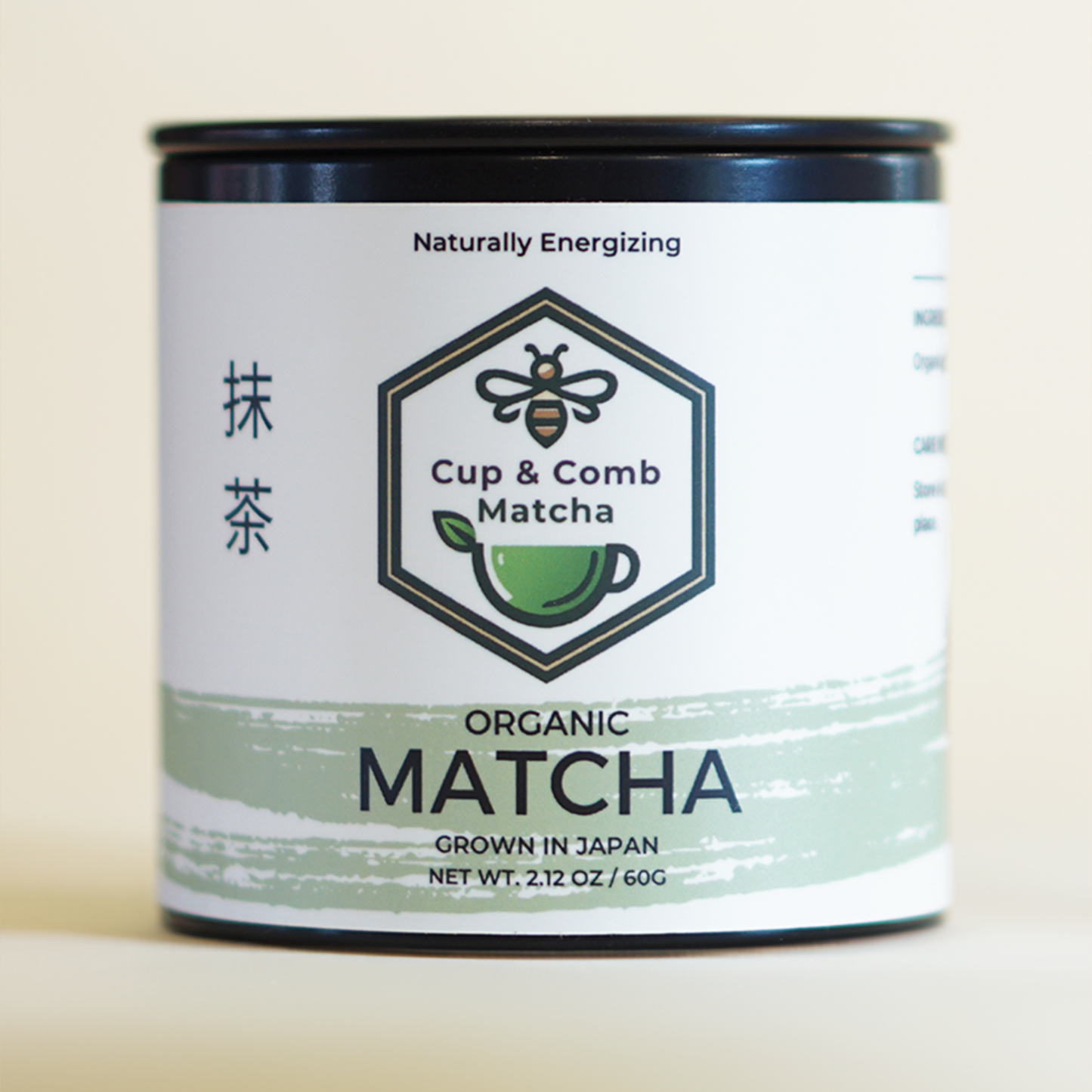 Front view of premium quality organic ceremonial grade matcha tin against a bokeh background.